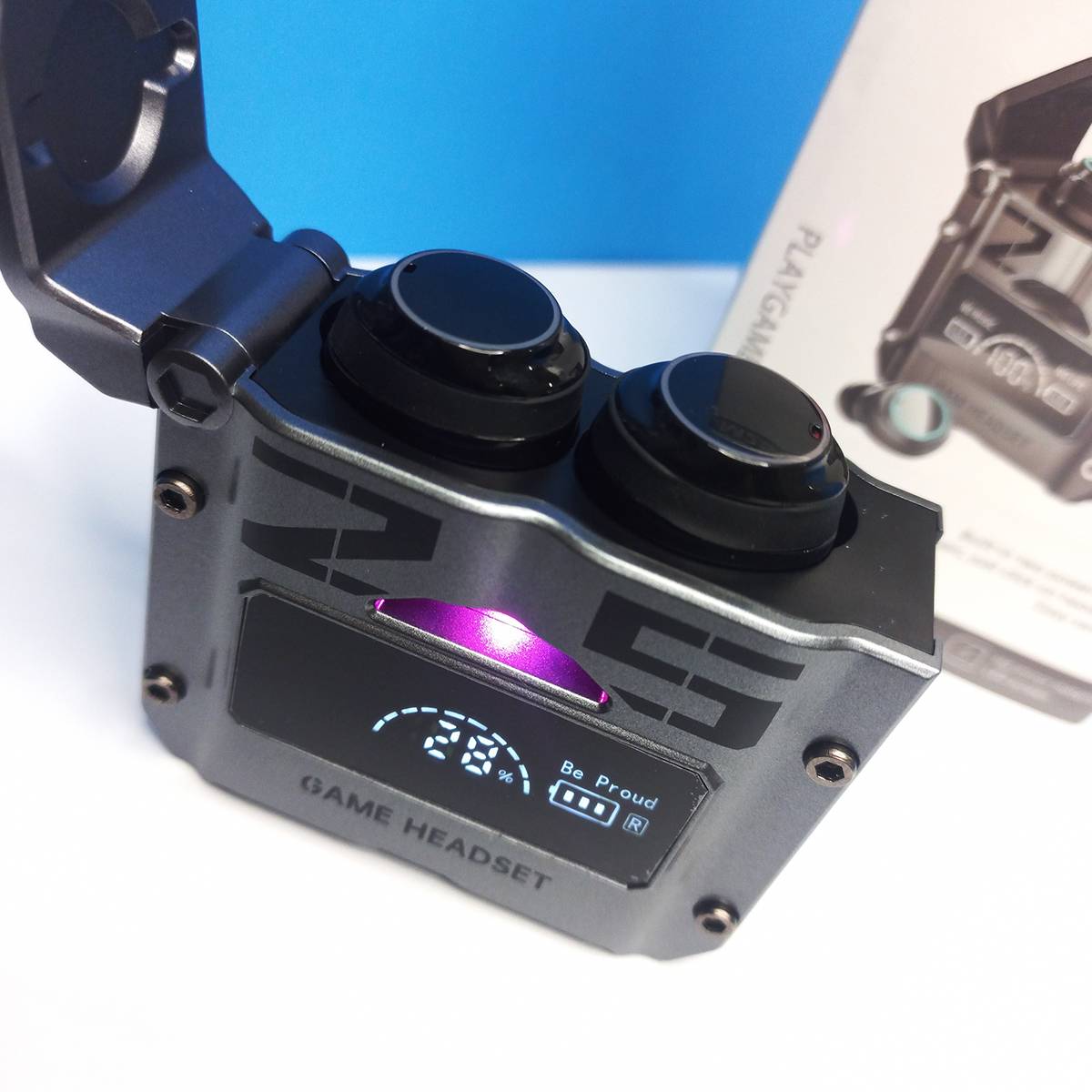 Close-up of a gaming headset with digital display and control buttons on a white background.