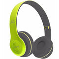 Wireless headphones with green and gray design on a white background